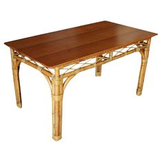 a wooden table with bamboo legs on white background