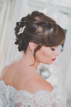 a woman wearing a wedding dress and hair comb