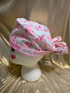 Pig ponytail scrub hat Patterns on hats may vary from hat to hat This two tone ponytail scrub cap features a coordinating fabric for the lining. The ponytail pouch is elasticized and the coordinating ribbon ties provide extra security for keeping hair in place. This style is adaptable for shorter styles as well, just tuck the ribbon pouch inside the cap portion and tie the ribbons at the base. Our style has coordinating band fabric that perfectly complements the main fabric. The placement of the Scrub Hat Patterns, Hat Ponytail, Ponytail Cap, Ponytail Scrub Hat, Hat Patterns, Hat Women, Scrub Hat, Coordinating Fabrics, Scrub Cap