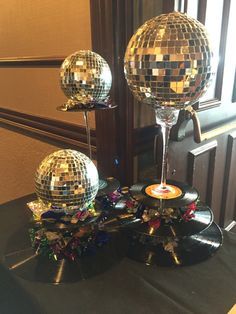 two disco balls are sitting on top of a table