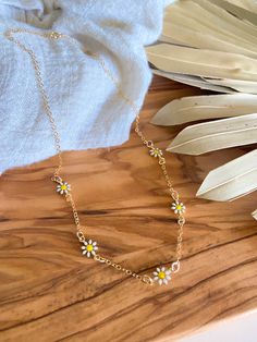 New! // Daisy Chain Necklace Enamel daisies suspended on 14kt gold filled chain with a spring ring clasp. Daisy Chain Necklace, Kill Devil Hills Nc, Daisy Chain, Gold Filled Chain, 14kt Gold, Spring Rings, Tassel Necklace, Charm Necklace, Necklace Etsy