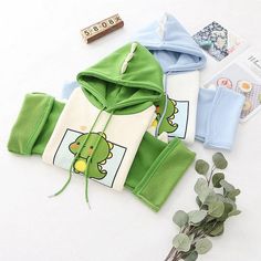 Product ID: JW5654 
 Material: Cotton 
 Color: Green, Blue 
 Thickness: Inner Fleece 
 Size Info: 
 Centimeter Sizes: 
 One Size: Bust 114 cm, Sleeve 43 cm, Length 60 cm 
 Inch Sizes: 
 One Size: Bust 44.9 inches, Sleeve 16.9 inches, Length 23.6 inches www.ccovv.com Japanese Letter, Color Block Hoodie, Baby Dino, Letter Print Hoodie, Color Block Sweatshirt, Baby Dinosaurs, Cartoon Dinosaur, Hoodie Green, Winter Colors