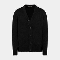 This black cardigan is tailored to a slim fit and features a 5-button closure, long sleeves, and a cozy, soft texture. Classic Black V-neck Sweater, Classic Black V-neck Sweater For Fall, Black Cashmere V-neck Sweater For Winter, Classic Black Merino Wool Sweater, Fitted Black Cashmere Outerwear, Black Cashmere Sweater For Formal Occasions, Formal Wool Button-up Cardigan, Classic Black Cashmere Cardigan, Formal Winter Cashmere Cardigan