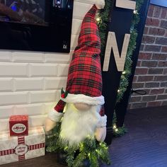 a christmas decoration is displayed in front of a tv