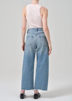 Inspired by our best-selling Ayla silhouette, the Ayla raw hem crop offers a relaxed rise, easy leg and cropped inseam. Style back to a classic white shirt for elevated ease. This style is true to size and intended to sit relaxed at the natural waist. For a higher and closer fit, we recommend sizing down. Looks Like: Vintage medium indigo with fading and a raw hem Feels Like: Non-stretch rigid regenerative cotton with a vintage hand This product is made with regenerative cotton from Citizens of Relaxed High Rise Jeans For Everyday, Relaxed High Rise Jeans For Spring, Cropped Bottoms With Five Pockets, Everyday Spring Cropped Bottoms, Spring Everyday Cropped Bottoms, Cropped Bottoms For Everyday Spring Wear, Everyday Light Wash Cropped Bottoms, Light Wash Cropped Bottoms For Everyday, Everyday Wide Leg Bottoms With Frayed Hem