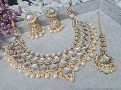 Gold Kundan Statement Kundan Set contrasted with Pearls With Jhumkey Earrings and Tikka  Stunning for Nikkah, Bridal, Party etc Silver Bridal Necklace For Wedding And Eid, White Jhumkas For Wedding And Eid, White Jewelry Sets For Wedding On Eid, Wedding Necklaces With Latkans For Eid, White Bridal Necklace For Diwali Party, White Bridal Sets For Eid Festive Occasion, White Bridal Sets For Eid Festivities, White Kundan Necklace With Latkans For Wedding, White Chandbali Jewelry Sets For Wedding