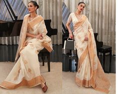 This Cream Copper Zari Woven Linen Saree gives a trendy, simple and classic look.This saree with its stylish patterns and attractive design will not fail to impress you. It adds a splash of vibrancy and charm to your casual dapper looks for the season. The silk blend is soft, fine and skin friendly which gives you a relaxed and comfortable feel. Combine this gorgeous saree with gold and silver colored jewellery, bangles and a matching pouch to create a complete look. Comes with matching blouse. The unstitched blouse can be customized upto 44 inches. Do Note: All the accessories shown are for styling purpose only. Slight color variation may occur due to photographic reasons. Fall and Pico : Done Draping Saree(Ready to wear) : On Request Extra Charges Occasion : Bridal Wear, Wedding, Party, Elegant Formal Cotton Silk Pre-draped Saree, Elegant Formal Pre-draped Cotton Silk Saree, Elegant Cotton Silk Blouse Piece For Eid, Formal Cotton Silk Saree With Sheer Dupatta, Bollywood Style Cotton Silk Pre-draped Saree For Formal Occasions, Formal Bollywood Pre-draped Cotton Silk Saree, Formal Blouse With Sheer Dupatta For Festive Occasions, Traditional Formal Blouse With Sheer Dupatta, Formal Cotton Silk Pre-draped Saree For Diwali