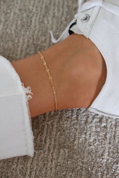 Simple Gold Anklet | Gold Dainty Anklet | Gold Ankle Bracelet | 14k Gold Filled Chain Anklet | Shimmer Chain Anklet | Minimal Gold Anklet DETAILS: * SIZE is 8" with 2" extender (total 10") * CHAIN is 14k Gold Filled * CLASP is 14k Gold Filled  It's safe to get your gold filled anklet wet, however we recommend you remove it in salt water or chlorine. WHAT IS GOLD FILLED? Gold filled components contain 100+ times more real gold than gold plated components resulting in a very durable and long lasti Simple Gold Anklet, Minimal Anklet, Gold Ankle Bracelets, Minimalist Gold Jewelry, Gold Chain Anklet, Ankle Bracelets Gold, Dainty Anklet, Anklet Gold, Dainty Gold Jewelry