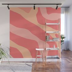 an abstract pink and orange wall mural in a living room