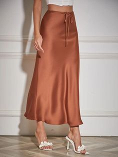 Elevate your style with our High Waist Long Satin Skirts for Women. Available in black, gray, and beige, these skirts feature a flattering high waist design and a mermaid hemline. Perfect for both casual and formal occasions, shop now for spring 2024! Long Satin Skirt, Satin Skirt, Formal Occasion, Womens Skirt, Shop Now, Satin, High Waisted, Grey, Black