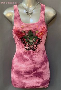 New Womens Vocal Apparel embellished crystal burgundy pink fleur de lis tie dye sleeveless tank top Beautiful magenta pink tie dyed tank top embellished with colorful stones. Beautiful Colors.  Darling fleur de lis colorful stone design on front. Back has the same print but no stones. Light and has stretch. You won't find this top anywhere else. Just GORGEOUS Made in USA by Vocal Apparel I have been selling Vocal clothing for over 15 YEARS now and just LOVE this brand! 100% Cotton - Has Lots of Stretch Measured without stretching/Juniors Sized - *Small - 13" across chest - 27" shoulder to hem *Medium - 14" across chest - 28" shoulder to hem BE VOCAL - STAND OUT IN A CROWD & PUT A GIRL IN IT before it's gone! XOXO Lisa - Put a Girl In It Always free shipping - Returns accepted within 14 day Fitted Tie Dye Cotton Tank Top, Fitted Cotton Tie Dye Tank Top, Spring Stretch Embellished Tank Top, Spring Embellished Stretch Tank Top, Fitted Tie Dye Tank Top, Purple Embellished Sleeveless Top, Fitted Embellished Pink Tops, Casual Pink Embellished Tops, Spring Tie-dye Fitted Tops