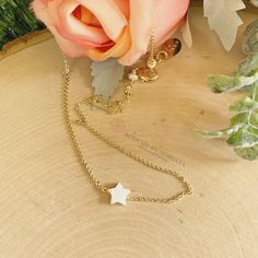 Tiny Mother of Pearl (Nacre) star necklace. The nacre has a high luster with white tones. Celestial jewelry is in at the moment. This is a lovely star necklace, it's a delight for the eyes! This dainty Mother of Pearl star, is made with a gold-plated chain. Perfect for everyday wear, this necklace looks great layered with other necklaces or by itself. When you put on a piece of jewelry, you probably focus on how it looks with your outfit or what it says about your style. Remember, in simplicity, 14k Gold Filled Star Charm Necklace As A Gift, 14k Gold-filled Star Charm Necklace As Gift, Dainty Adjustable Star Charm Necklace, White Charm Choker Necklace As A Gift, White Charm Choker Necklace For Gift, Adjustable Star-shaped Necklace With Delicate Chain, White Star-shaped Clavicle Chain Necklace, Dainty White Choker With Delicate Chain, White Star Charm Necklace For Gifting