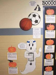 a bulletin board with halloween decorations on it and a basketball ball in the air next to it