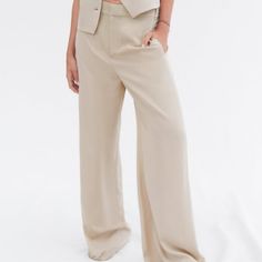 Side Pockets And False Back Welt Pocket. Wide Leg. Front Zip, Button, And Metal Hook Closure. Taupe Brown | Summer Business Casual Pants With Buttons, Business Casual Summer Pants With Buttons, Tailored Wide Leg Pants With Button Closure, Wide Leg Pantsuit With Button Closure For Work, Beige High-waisted Wide Leg Pants With Button Closure, Beige High Waist Wide Leg Pants With Button Closure, Summer Straight Pants With Button Closure, Summer Wide Leg Dress Pants With Button Closure, Summer Wide-leg Dress Pants With Button Closure