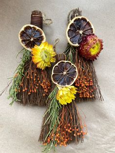 an arrangement of dried fruit and flowers on display