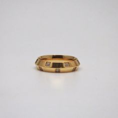 A delicate gold loop ring dipped in 18k gold. This classic simple band features a set of cubic zirconia gems. This ring utters timeless elegance of simple jewelry, which is ideal for woman who love fashion as much as we do. Lush Band, Dot Ring, Reunion Island, Simple Band, Precious Jewels, Jewelry For Men, Enamel Ring