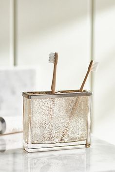 Lend sparkling style to your bathroom with this mercury glass toothbrush holder. | Vizcaya Toothbrush Holder by Anthropologie in Beige Brushed Nickel Bathroom Accessories, Ny Loft, Glass Bathroom Accessories, Tooth Brush Holder, Cute Tooth, Vermont Country Store, Bath Collection, Tooth Brush, Candles For Sale