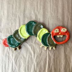 a very cute looking toy made to look like a caterpillar