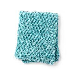 a blue knitted dishcloth on a white background with clipping to the side