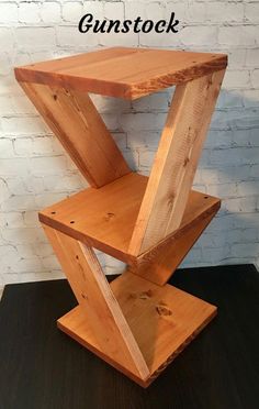 a wooden shelf with the words gunstock on it and an image of a brick wall behind it