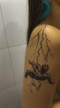 a woman with a tattoo on her arm