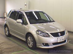 a silver car is parked in a garage