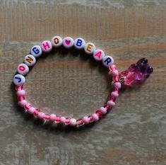 ATEEZ Jongho beaded bracelet, pink & purple beads.  Will be packaged with care! Pink Round Beaded Bracelets For Birthday, Pink Name Bracelet With Colorful Beads For Friendship, Adjustable Pink Name Bracelet With 8mm Beads, Pink Beaded Name Bracelet As A Gift, Pink Beaded Bracelets With 8mm Beads For Birthday, Pink Beaded Name Bracelet As Gift, Pink Beaded Name Bracelet For Gift, Purple Stretch Bracelet With Letter Beads As Gift, Purple Stretch Bracelet With Letter Beads For Gift