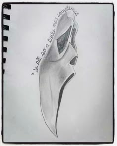 a drawing of a mask with words written on it