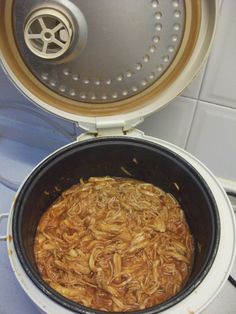 a pot filled with food sitting on top of a stove