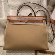 Brand New 2022 Hermes Herbag 31 In Trench/Fauve. Come With Original Receipt. Full Set, No Box. Open To Reasonable Offers. Hermes Birkin Brown, Herbag Hermes, Herbag 31, Uni Bag, Multi Pouch, Hermes Lindy, Hermes Birkin Handbags, Birkin Handbags, Hermes Orange