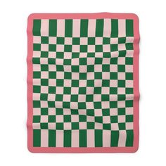 a green and white checkered blanket with pink border