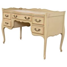 an antique style desk with drawers is shown