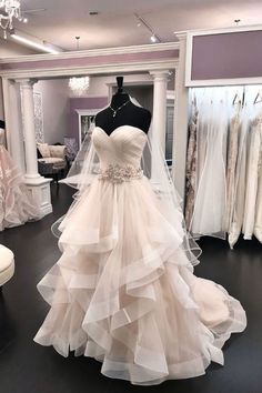 a wedding dress on display in a bridal shop