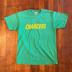 Dope jersey shirt from the '90s. Spellout on front and number on back. Has general wear and some cracking on the number otherwise in good condition. Fits S/M (18.5x26).  Brand: FOTL Size: S Color: Green, Yellow Condition: Good Green T-shirt With Letter Print For Fans, Green Letter Print T-shirt For Fan Gear, Throwback T-shirt With Letter Print, Retro Team Name T-shirt For Streetwear, Green T-shirt With Team Name For Fans, Green Sports Season T-shirt For Fan Gear, College Throwback T-shirt With Team Logo, Green T-shirt For Sports Season Fan Gear, Retro Green T-shirt For Fans