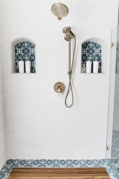 a shower head and hand shower in a bathroom