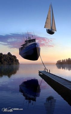 a boat floating in the water next to a dock with a sailboat on it