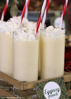 three glasses filled with ice cream and topped with straws