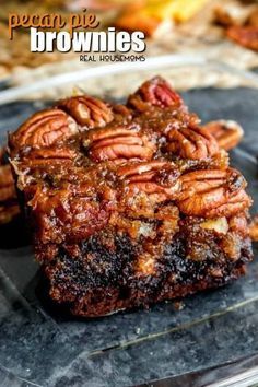 three pieces of meat sitting on top of a cutting board