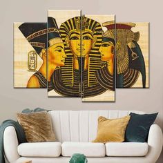 an egyptian painting on the wall in a living room with white couch and coffee table