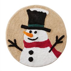 a close up of a snowman on a door mat