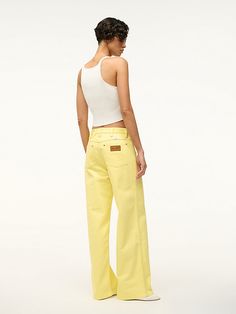 THE Loose JEAN The Loose Jean is our ultra-relaxed fit. This mid-rise jean sits below the natural waist and a wide leg. This style is available in 2 inseam lengths and features our STAUD belt loop detail at the waist. Size up to wear as a low-rise boyfriend fit. Wrangler Women, Low Rise Jean, Spring Flats, Custom Handbags, Yellow Pants, Outdoor Pants, Loose Jeans, Wrangler Jeans, Mid Rise Jeans