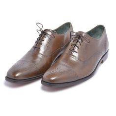 If you’ve been thinking which lace shoes to invest in, then look no further. These brown oxford capped toe brogue genuine leather shoes are more splendid than you ever imagined! The vamp covers the instep and toes, whereas the quarter wraps around the heel and joins the vamp in the middle of the foot. When it comes to versatility, elegance, and quality, you can never go wrong with these brown oxford capped toe brogue genuine leather shoes. Following are their features; Made of high-quality leather Capped toe with brogue design Oxford style handmade When it comes to style and quality, we guarantee you a great blend of both with this winning pair. Wingtip Oxfords With Brogue Detailing For Galas, Classic Oxford Lace-up Shoes With Rubber Heel Cap, Leather Oxfords With Leather Sole For Derby, Timeless Leather Sole Oxfords, Goodyear Welted Oxford Dress Shoes With Almond Toe, Goodyear Welted Almond Toe Oxfords, Lace-up Oxford Shoes With Rubber Sole, Wingtip Oxfords With Rubber Heel Cap For Galas, Wingtip Lace-up Shoes With Brogue Detailing For Galas