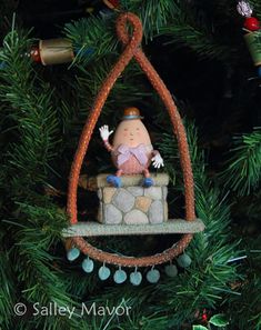 a christmas ornament hanging from a tree