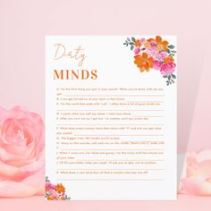 a pink rose next to a white card with the words daily minds written on it