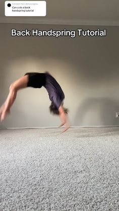 a man is doing a handstand on the floor with his feet in the air