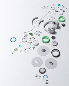 an assortment of different types of buttons and other items on a white surface with space for text