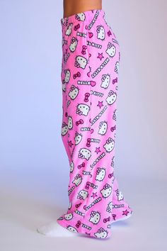 From our Hello Kitty and Friends x Forever 21 collection, this pair of fleece pajama pants features an elasticized waist, allover "Hello Kitty" text and Hello Kitty character, star, bow, and heart graphics, on - seam pockets, and wide leg. | © 2022 SANRIO CO., LTD. Used Under License. | 100% polyester | Hand wash cold | Model is 5'6" and wearing a Small | Inseam: 28" | Hello Kitty & Friends Hello Kitty Pajama Pants Shop styles similar to Shein, Fashion Nova, ASOS, Old Navy, H&M, LightInTheBox, C Muzică Rock, Kitty Clothes, Hello Kitty Clothes, Hello Kitty Friends, Cute Pjs, Hello Kitty Characters, Cute Pajama Sets