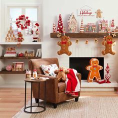 a living room decorated for christmas with gingerbread cookies and decorations on the mantel