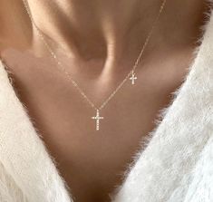 Enjoy a timeless diamond double cross necklace made from 100% recycled gold and cubic zirconia, the perfect every day piece for gifting or treating yourself. This necklace will instantly transform any look into a fashion statement. With a dainty 14k gold chain and two flawless diamond cross pendants, this necklace is both versatile and elegant. Material & Measurements Material: 14k Gold on Sterling Silver, cubic zirconia. Measurements: 35cm+5cm, Cross 6x10mm Jewelry Care Even though our piec Cross Necklace Aesthetic, Double Cross Necklace, Cross Accessories, Diamond Cross Necklace, S Necklace, Flawless Diamond, Cross Chain, Diamond Cross Pendants, Classy Jewelry