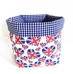 a blue and white checkered basket with british flags on it